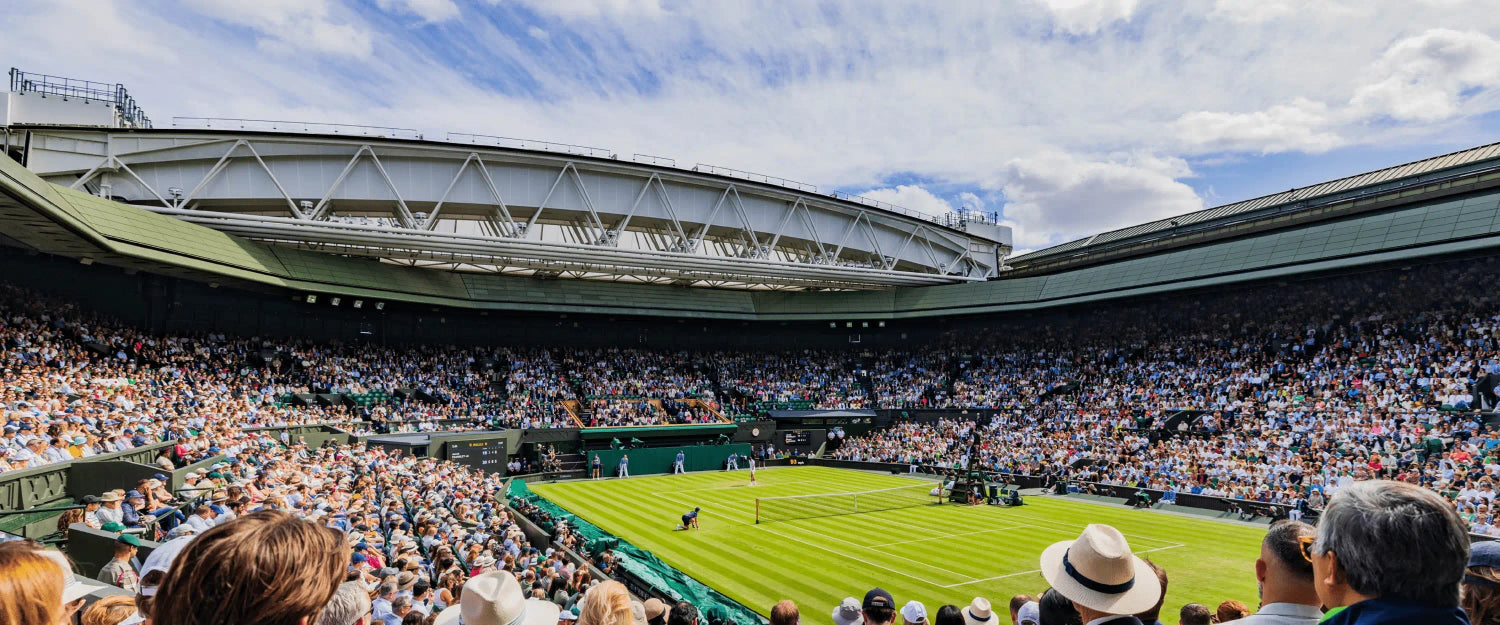 Wimbledon IV drip therapy event with people enjoying tennis match on centre court