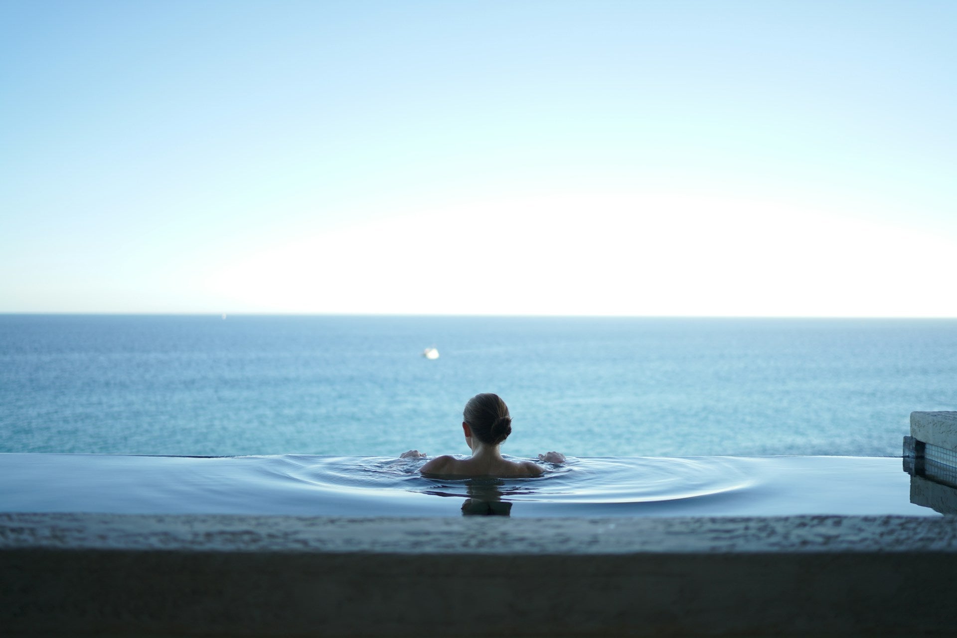 testimonial image of ooking out to sea from poolside